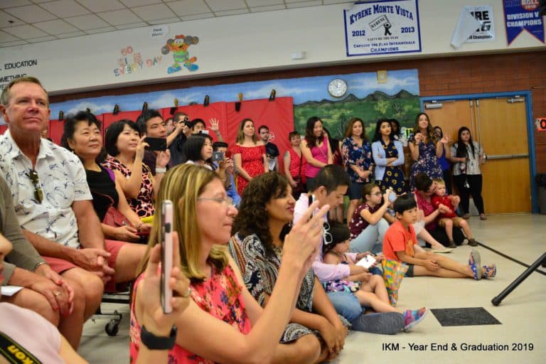 Crowd at a school graduation ceremony.