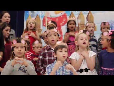 Children singing in a classroom