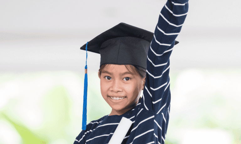 Happy graduate girl celebrating success.